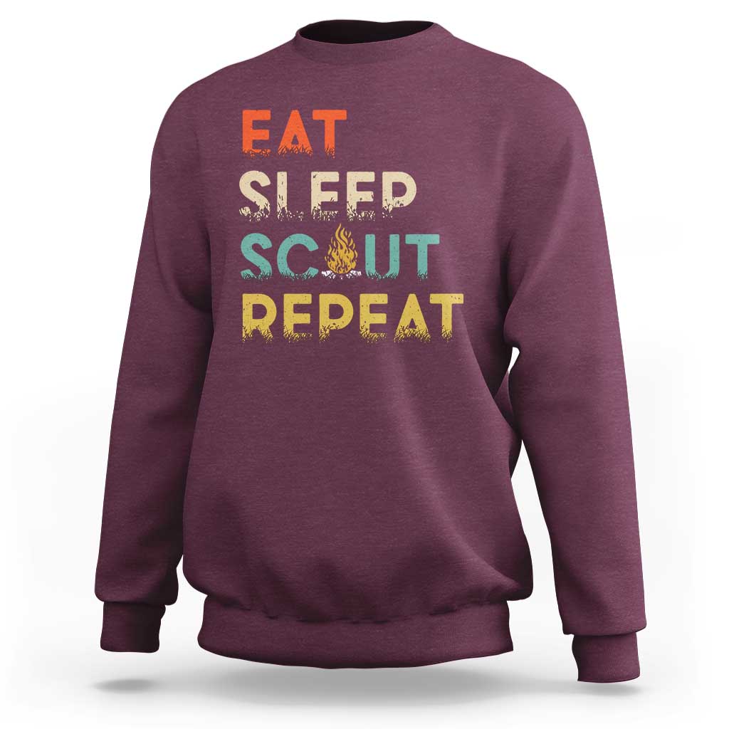 Maroon crewneck sweatshirt with “EAT SLEEP SCOUT REPEAT” graphic
