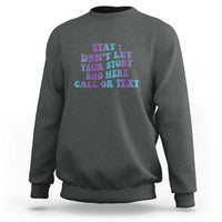 Dark gray crewneck sweatshirt with front graphic: Stay, 988, call or text