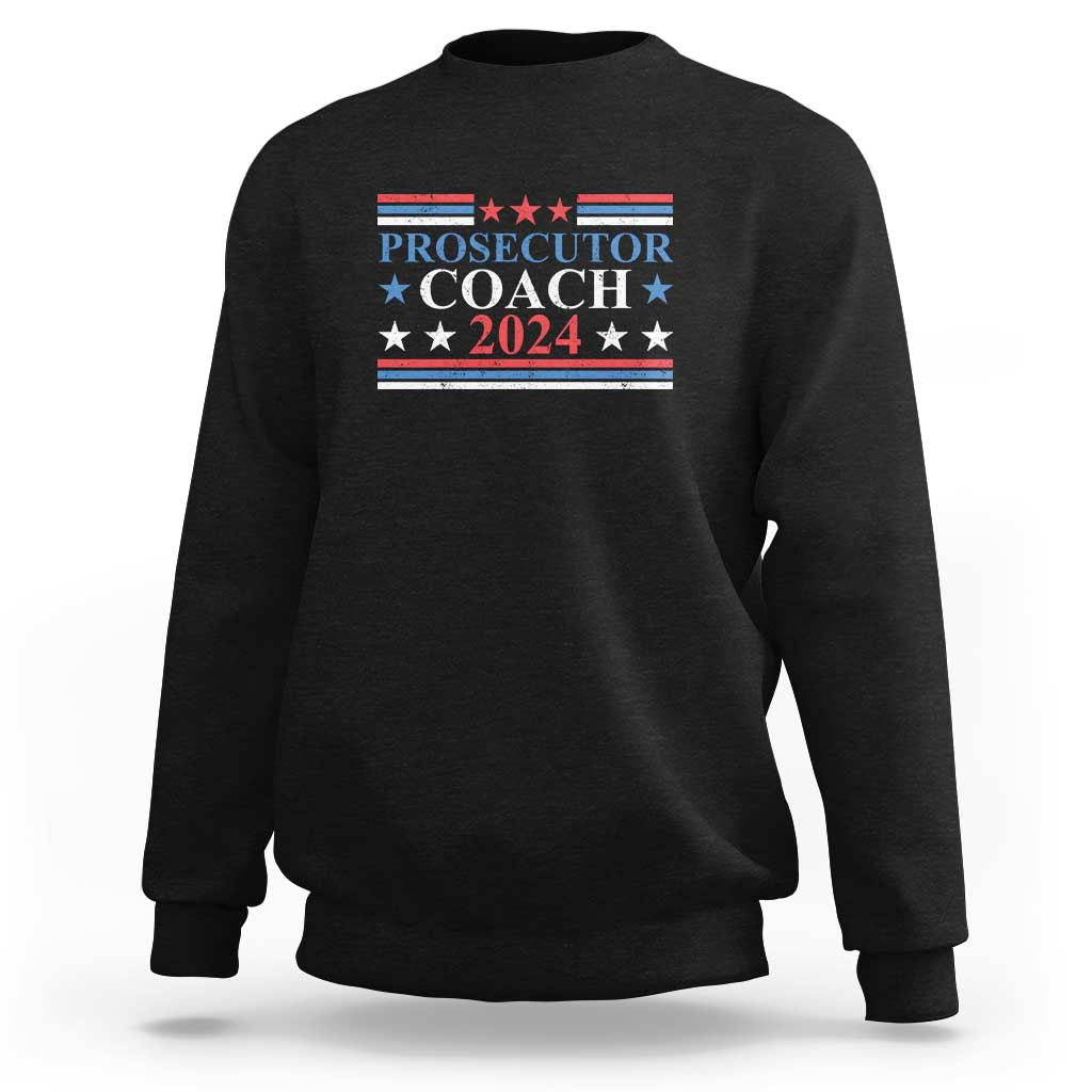 Black sweatshirt with "PROSECUTOR COACH 2024" chest graphic
