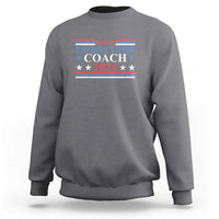 Charcoal gray sweatshirt with "PROSECUTOR COACH 2024" chest graphic