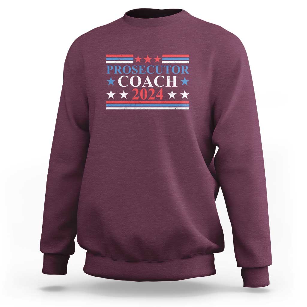 Maroon sweatshirt with "PROSECUTOR COACH 2024" chest graphic