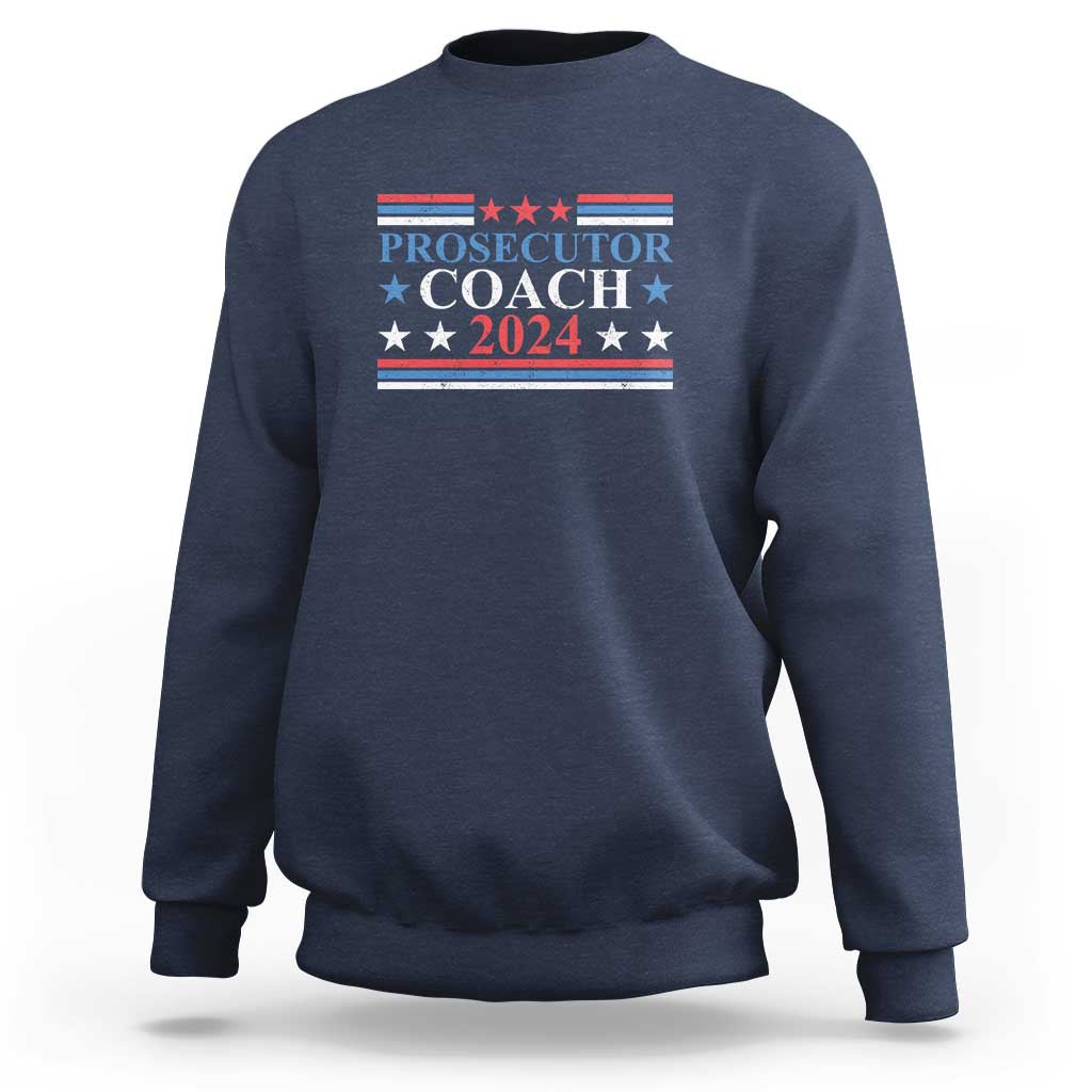 Navy sweatshirt with "PROSECUTOR COACH 2024" chest graphic