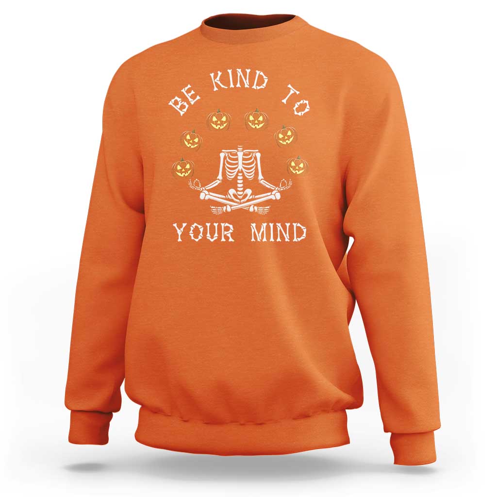 Orange Halloween crewneck sweatshirt with skeleton pumpkin mind graphic on back