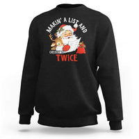 Black Christmas Santa sweatshirt featuring Makin' A List and check twice graphic