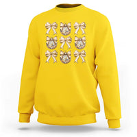 Daisy yellow sweatshirt with gold bow and plaid ornament graphic on front