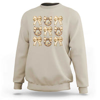 Sand sweatshirt with gold bow and plaid ornament graphic on front