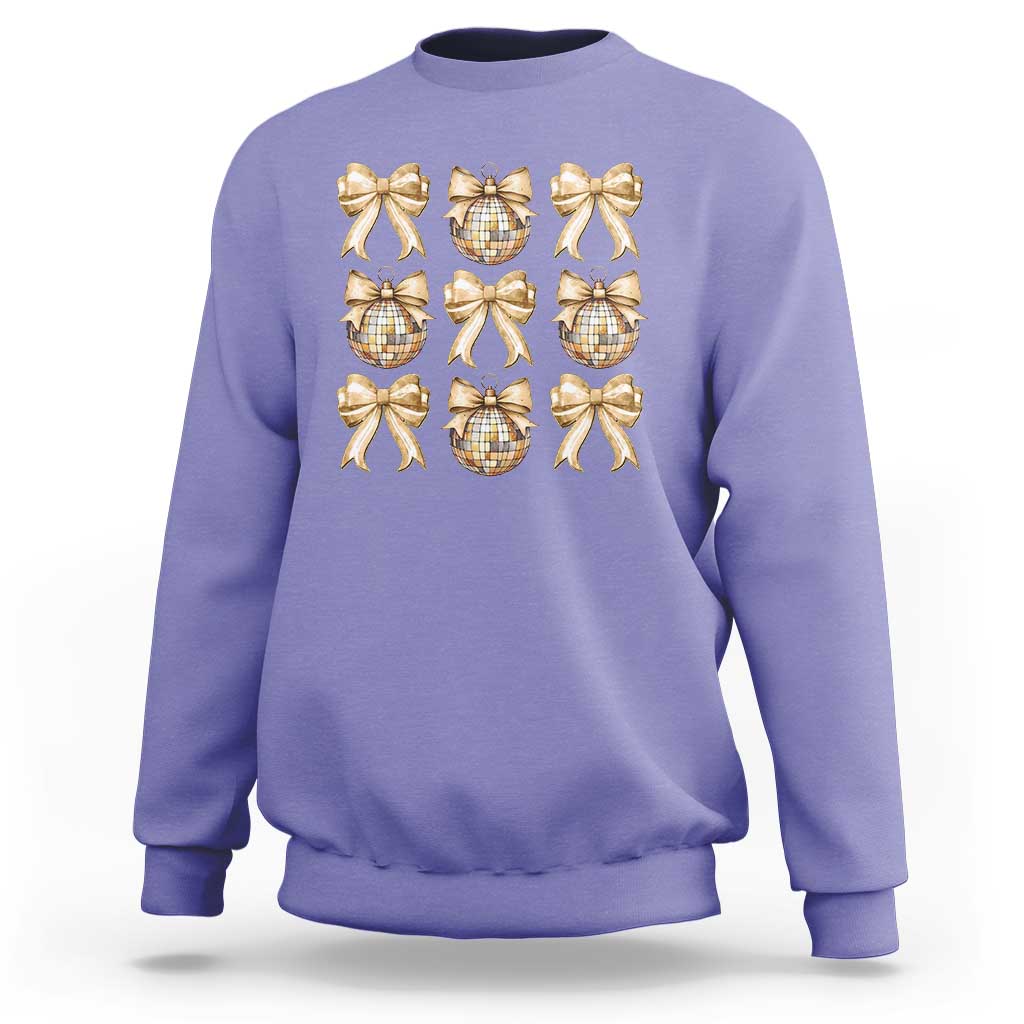 Violet sweatshirt with gold bow and plaid ornament graphic on front
