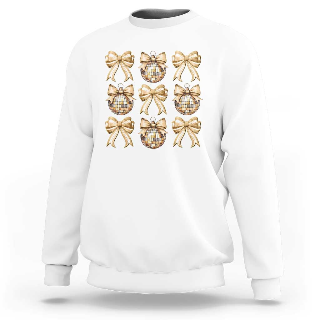 White sweatshirt with gold bow and plaid ornament graphic on front