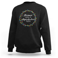 Black sweatshirt with circular Christmas lights graphic and text at the chest