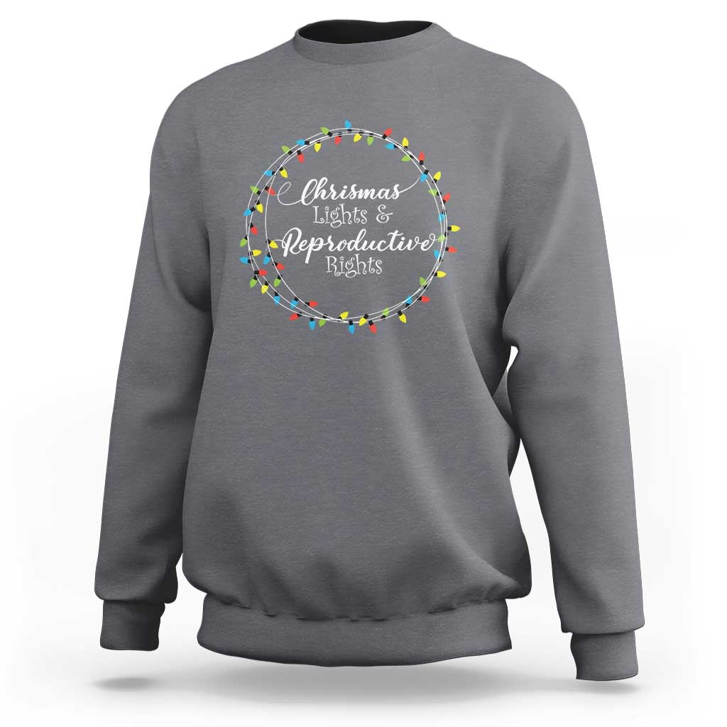 Light gray heather sweatshirt with circular Christmas lights graphic and text at the chest