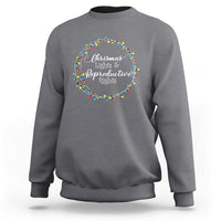 Light gray heather sweatshirt with circular Christmas lights graphic and text at the chest