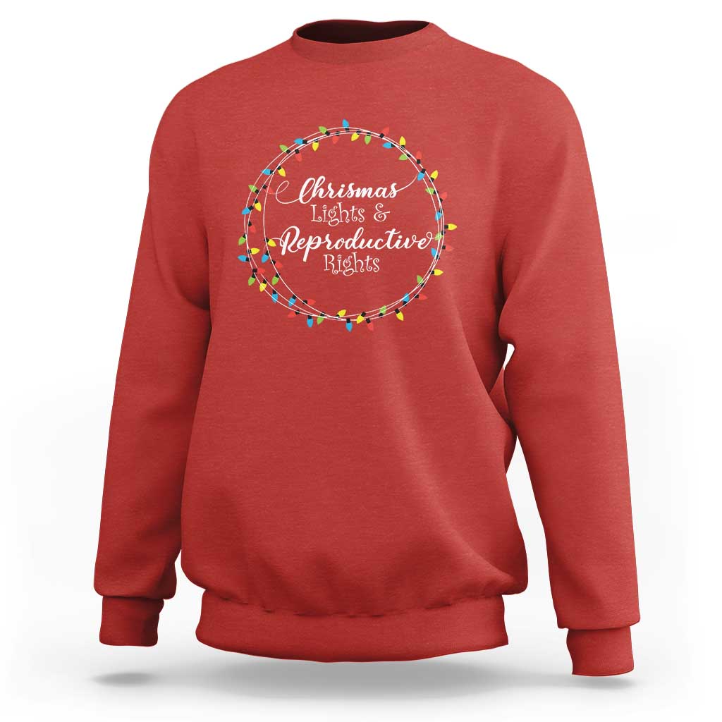 Red sweatshirt with circular Christmas lights graphic and text at the chest