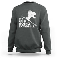 Dark heather gray skiing sweatshirt with white skier graphic and slogan "My life is going downhill".