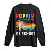 Black long-sleeve shirt with colorful “Poppin’ school days” graphic on front