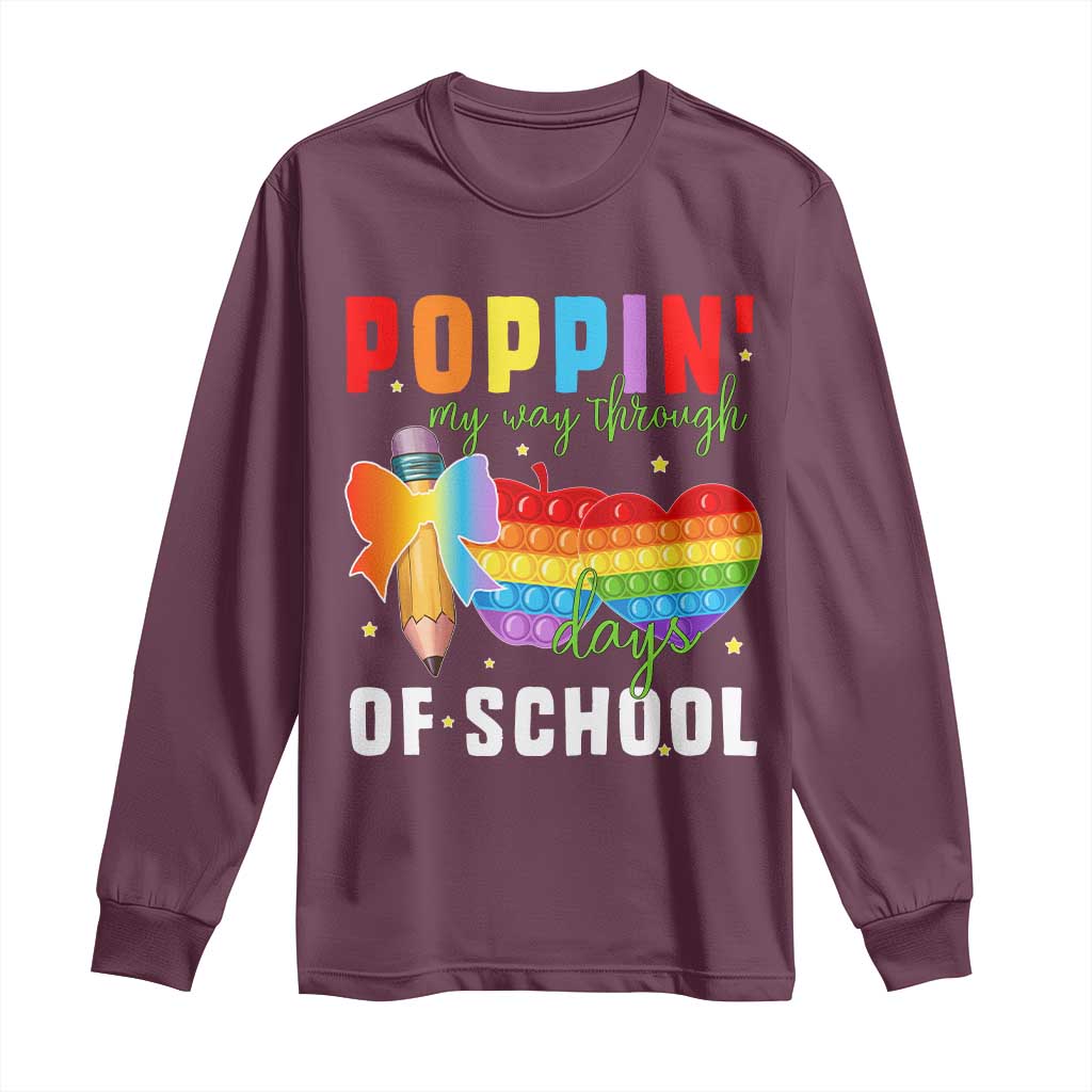 Maroon long-sleeve shirt with colorful “Poppin’ school days” graphic on front