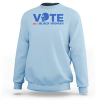 Light blue sweatshirt with VOTE graphic and “like a BLACK WOMAN” text on chest
