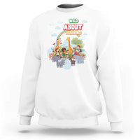 White crewneck sweatshirt with colorful zoo animal graphic on front