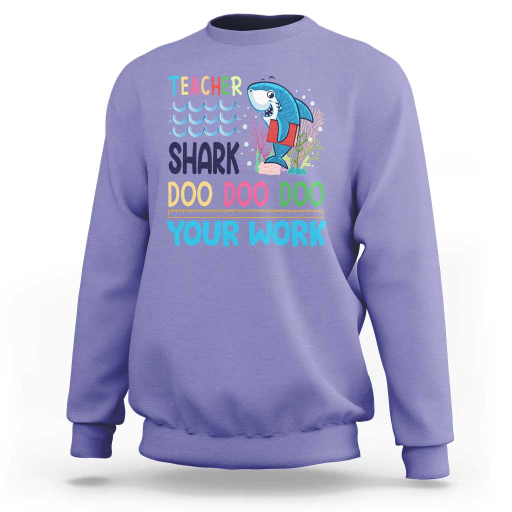 Violet crewneck sweatshirt with teacher shark 'Doo Doo Doo Your Work' graphic