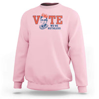 Pink women's crewneck sweatshirt with 'VOTE' and 'WE'RE RUTHLESS' chest graphic.