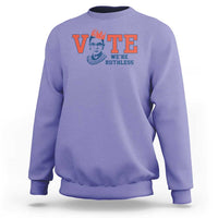 Violet women's crewneck sweatshirt with 'VOTE' and 'WE'RE RUTHLESS' chest graphic.