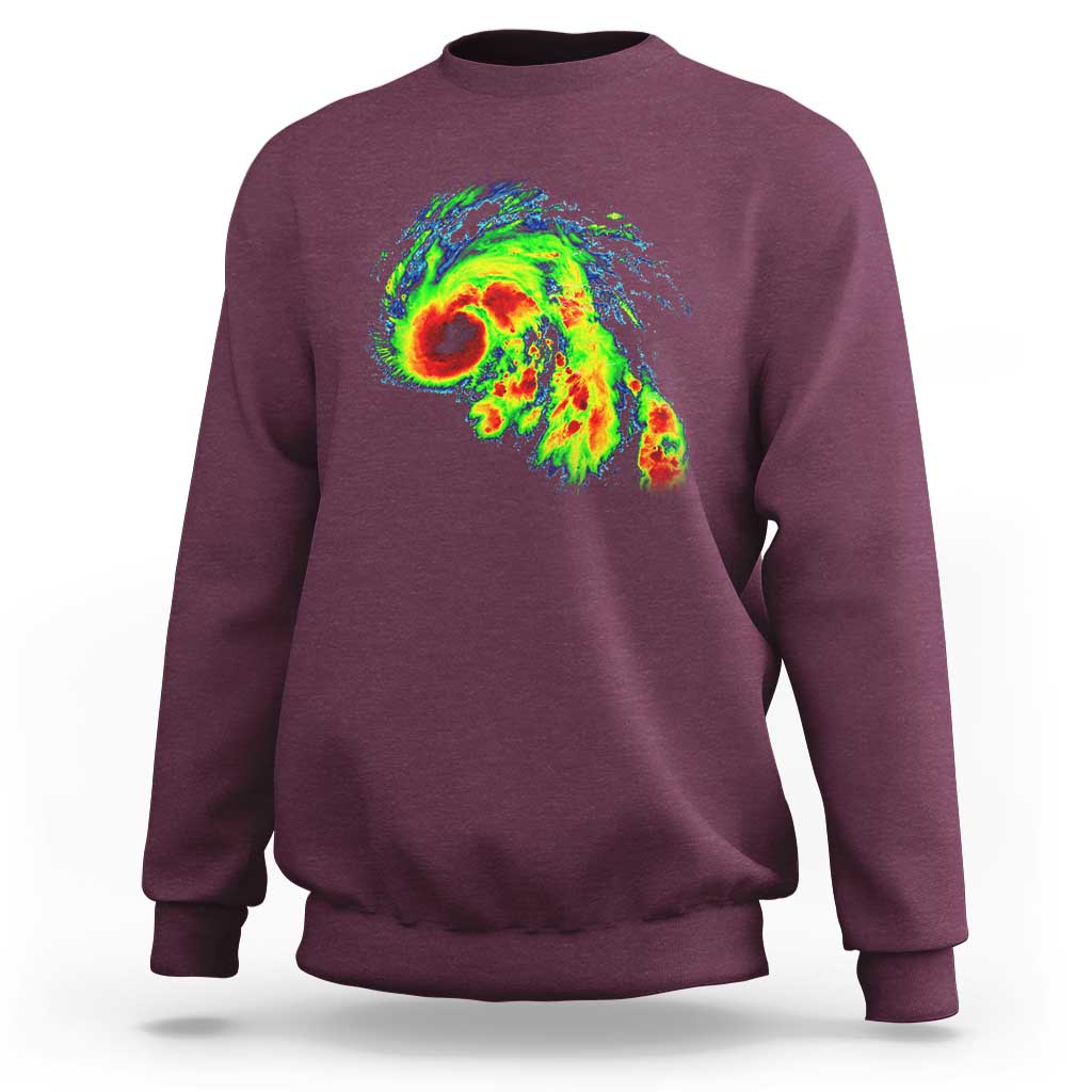 Maroon crewneck sweatshirt with large colorful storm radar graphic on the back