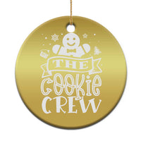 Gold round ornament with smiling cookie character and “THE COOKIE CREW” text