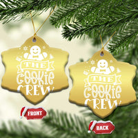 Gold snowflake-shaped ornament with hanging loops and “THE COOKIE CREW” text