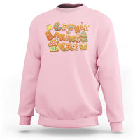 Light pink crewneck sweatshirt with colorful gingerbread cookie holiday graphic