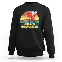 Black crewneck sweatshirt with Santa graphic and “Become Ungovernable” text