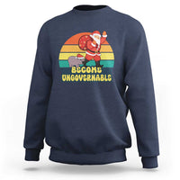 Navy crewneck sweatshirt with Santa and cartoon cow graphic and “Become Ungovernable”