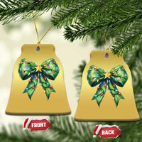 Two bell-shaped gold Christmas ornaments with green bow and gold star, hanging from gold strings.