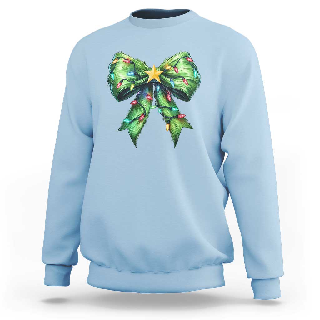 Light blue Christmas coquette sweatshirt with green bow and star holiday graphic
