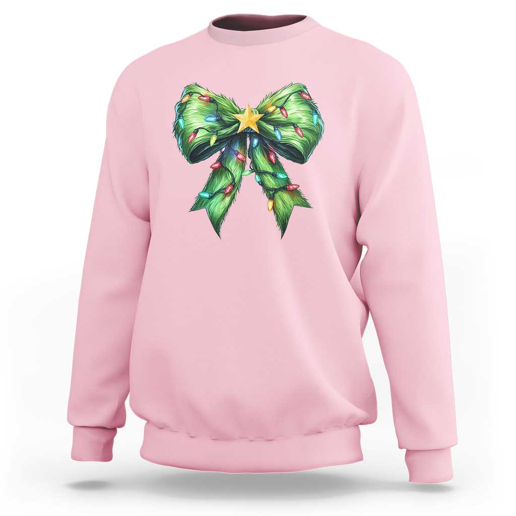 Light pink Christmas coquette sweatshirt with green bow and star holiday graphic