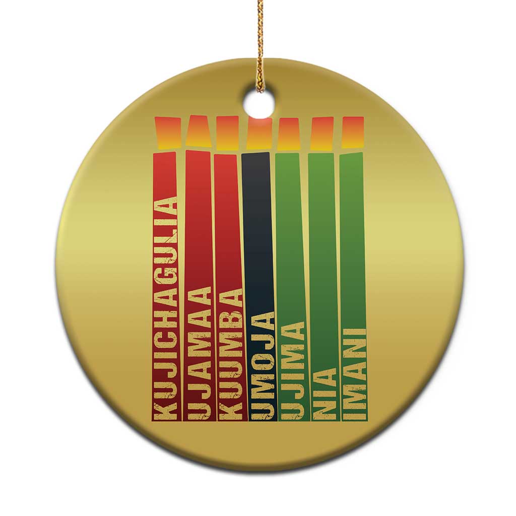 Gold round Kwanzaa kinara candle Christmas ornament close-up with hanging cord and stripes