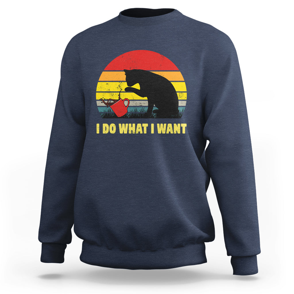 Navy sweatshirt with black cat sunset graphic and “I DO WHAT I WANT”