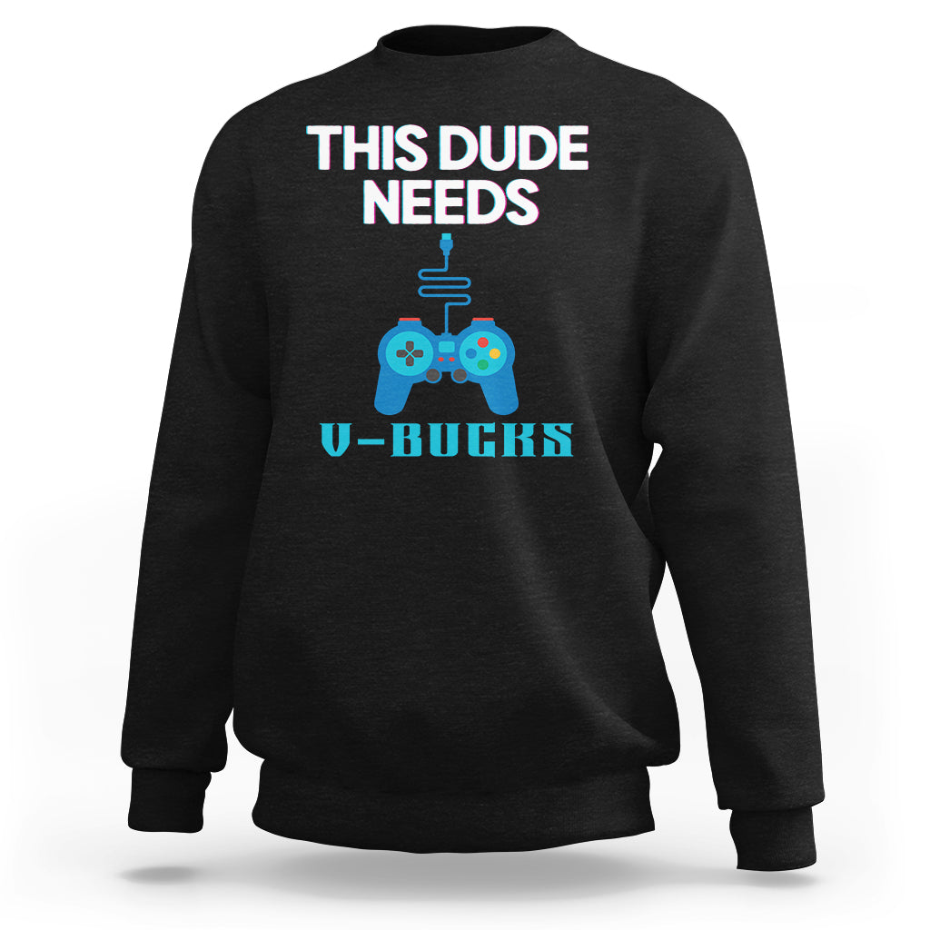 Black crewneck sweatshirt with “THIS DUDE NEEDS” controller graphic and V-BUCKS text