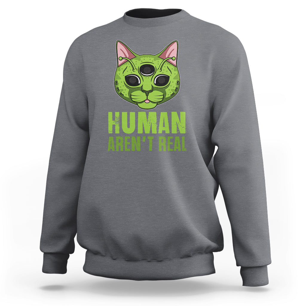 Charcoal crewneck sweatshirt with alien cat graphic and "HUMAN AREN'T REAL" print