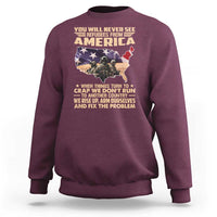 Maroon crewneck sweatshirt with America map graphic and slogan print on back.
