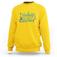 Yellow crewneck sweatshirt with mermaid tail graphic and colorful “Mermaid Vibes” print