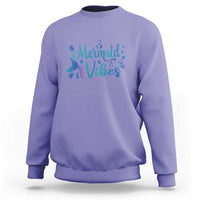 Purple crewneck sweatshirt with mermaid tail graphic and “Mermaid Vibes” text