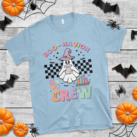Light blue Halloween graphic T-shirt with witch ghost and colorful “BOO-HAVIOR” text