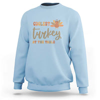 Light blue sweatshirt with turkey graphic 'Coolest Turkey at the Table'
