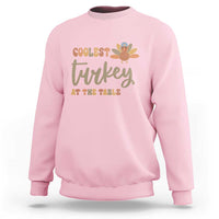 Light pink sweatshirt with turkey graphic 'Coolest Turkey at the Table'
