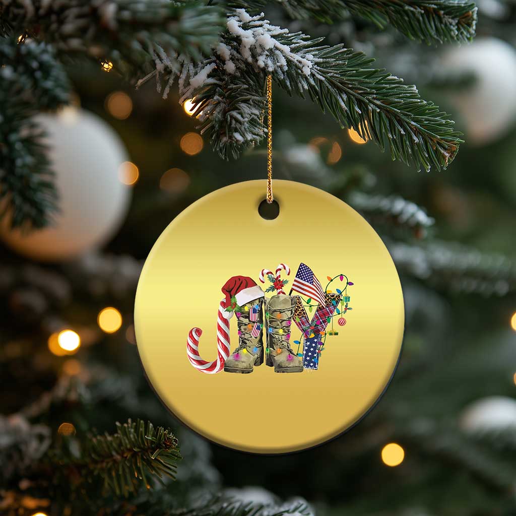 Gold round Christmas ornament with veterans graphic, hanging on a tree