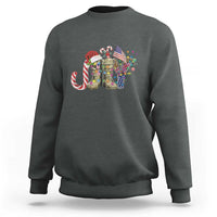 Heather gray crewneck sweatshirt with Christmas veterans graphic and candy cane detail