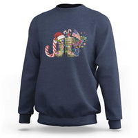 Navy crewneck sweatshirt with Christmas veterans graphic and candy cane-striped cane