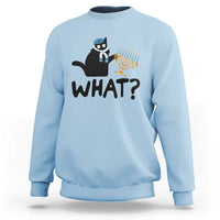 Light blue crewneck sweatshirt with black cat Hanukkah graphic and bold “WHAT?” text