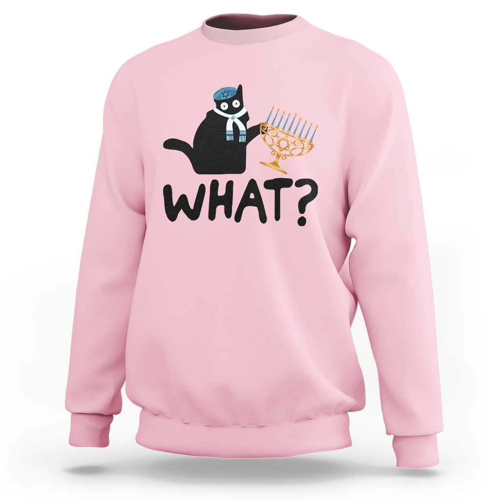 Light pink crewneck sweatshirt with black cat Hanukkah graphic and bold “WHAT?” text