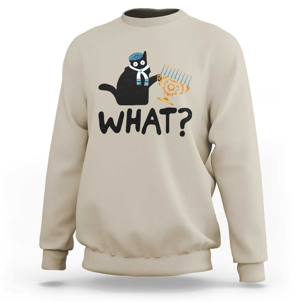 Sand crewneck sweatshirt with black cat Hanukkah graphic and bold “WHAT?” text