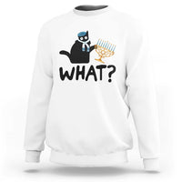 White crewneck sweatshirt with black cat Hanukkah graphic and bold “WHAT?” text